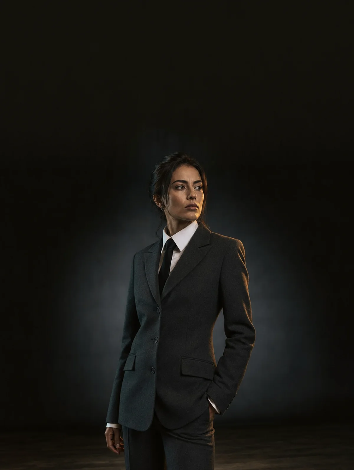 Generated fashion campaign still of a model wearing a charcoal tailored blazer