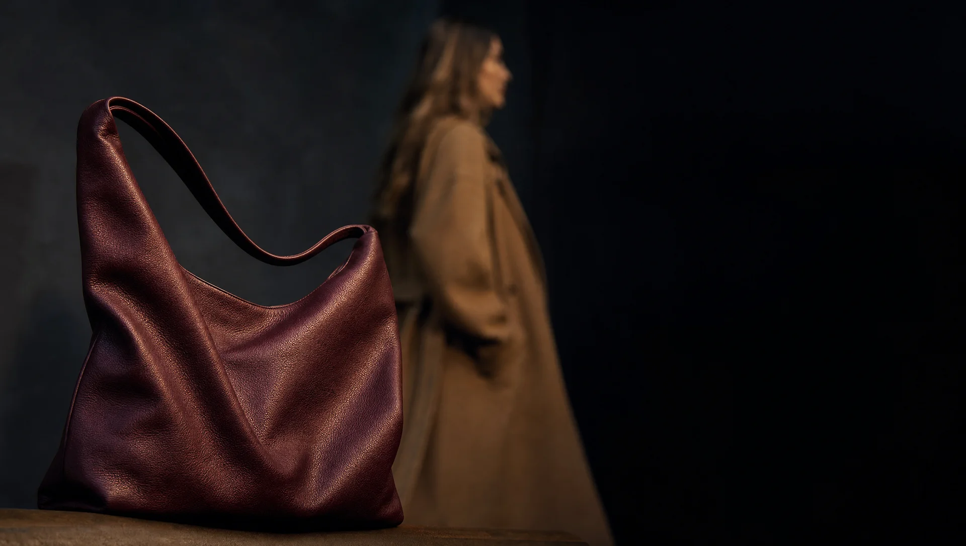 A model carrying a leather tote bag, cropped tall for an Instagram Story